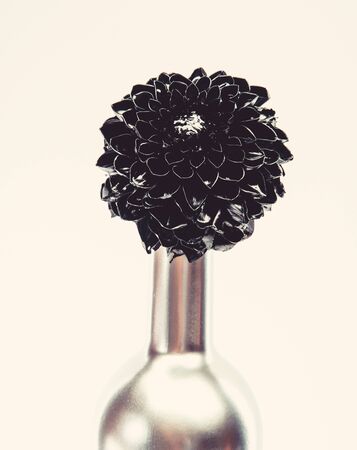 Abstract art. Eternal beauty. Fashion bouquet. Winery concept. Floral wine. Metal flower in steel wine bottle. Forging and sculpture. Alcohol drink. Luxury wine. Metallic steel color. Floral shopの写真素材