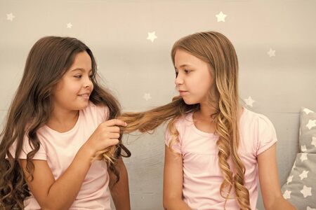 Girls sisters spend pleasant time communicate in bedroom. Benefits having sister. Awesome perks of having sister. Sisters older or younger major factor in siblings having more positive emotionsの写真素材