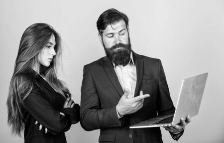 Waiting for new ideas. business couple. confident mature man with laptop. sexy woman secretary looking in computer. businessman with partner. communication and meeting. modern technologyの写真素材