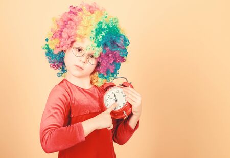 Happy little girl. International childrens day. Child care. Happy moments. Kid hold alarm clock....