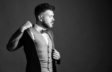 businessman with beard in tie. mature illusionist. Bride groom ready for wedding. esthete. stylish art director. business in modern life. bearded man in formal tuxedo suit. Perfection in every detailの写真素材
