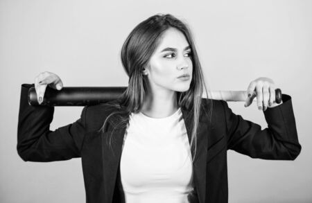 Life game. Business strategy. Aggressive business. Business lady boss. Decisive actions. Confidence and strength. Woman pretty girl bear formal jacket and hold baseball bat. Pretty and dangerousの写真素材