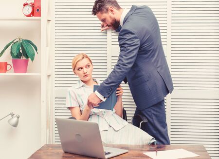 Disrespect. Sexual harassment in workplace. Girl indecent behavior.の写真素材
