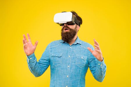Enjoy game in 3D space. Game development. Digital technology. Living alternative life. Hipster play video game. Bearded man explore vr. Gamer concept. Gaming hobby. Cyber sport. Augmented realityの写真素材