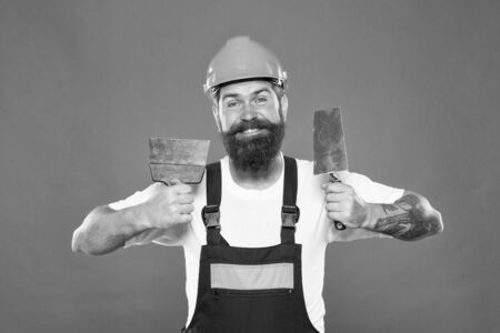 Man bearded laborer repairing in workshop. Foreman inspector. Repair and renovation. Engineer architect. Guy worker in hard hat. Builder regular worker in helmet hold tools. Quick repair. Repair tipsの写真素材