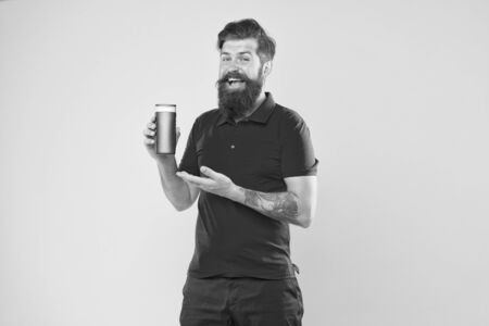 Personal hygiene. Shampoo for hair type. Make hair stronger. Man handsome bearded hipster hold bottle shampoo shower gel. Male beauty concept. Presenting shampoo product. Shampoo conditioner for menの写真素材