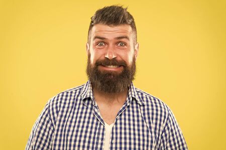 Because everyone deserves to smile. Happy man on yellow background. Bearded man smiling. Caucasian man with mustache and beard hair on unshaven face. Brutal man with long beard and stylish haircutの写真素材