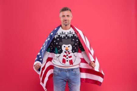 happy new year. celebrating christmas in usa. international holiday. man with american flag. back home on holidays. christmas traditions in celebration. 2020 new year. santa is all americanの写真素材