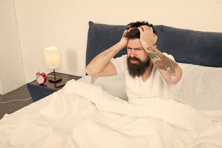 Time to relax. energy and tiredness. mature male with beard in pajama relax in bed. bearded man hipster sleep in morning. asleep and awake. brutal sleepy man in bedroom. just need more relaxの写真素材
