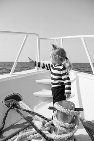 Baby boy enjoy vacation sea cruise ship. Child sailor. Boy sailor travelling sea. Boy sailor striped shirt sea yacht travel around world. Little sea traveller. Beach is calling and we must goの写真素材