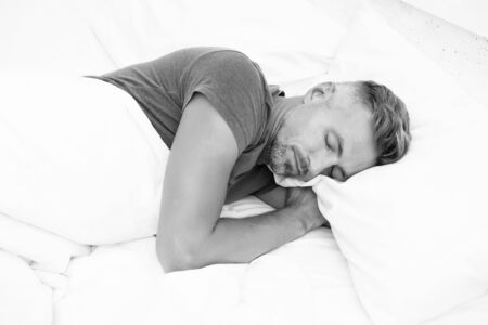 Sleeping beauty. Man handsome guy lay in bed. Get enough amount of sleep every night. Tips sleeping better. Bearded man sleeping face relaxing on pillow. Pleasant relaxation concept. Perfect rest.の写真素材
