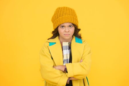 Fall go away. Unhappy little schoolchild dislike fall weather. Small girl back to school in fall. November 20 childrens day. Autumn holidays. Fall seasonの写真素材