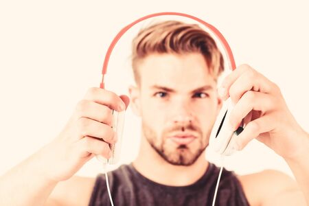 Sexy muscular man with headphone in the handの写真素材
