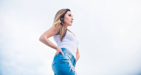 Forgoing designer labels does not have to mean sacrificing style. Street style. Wearing accessible pieces. Fashion girl. Stylish sexy girl outdoors sky background. Daily outfit. Developing own styleの写真素材