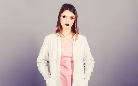 Woman pretty doctor wear white uniform. Girl makeup face professional doctor. Medical treatment recommendations. Prescribed by doctor. Health care. Medical education. Medicine concept. Private clinicの写真素材