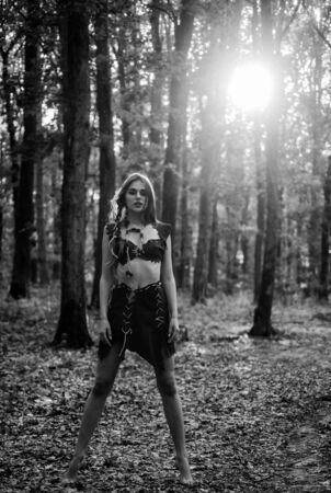 Forest fairy. Fashion and culture. Wilderness of virgin woods. Wild attractive woman in forest. Folklore character. Living wild life untouched nature. Sexy girl. Wild human. Female spirit mythologyの写真素材