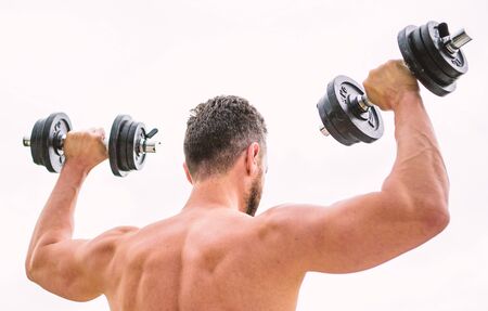 Great progress. Healthy lifestyle. fitness and sport equipment. man sportsman weightlifting. steroids. athletic body. Dumbbell gym. Muscular back man exercising in morning with barbell.の写真素材