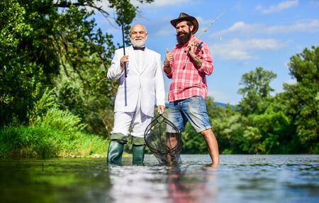 Ready for fishing. Fly fishing adventures. friends men with fishing rod and net. hobby of...