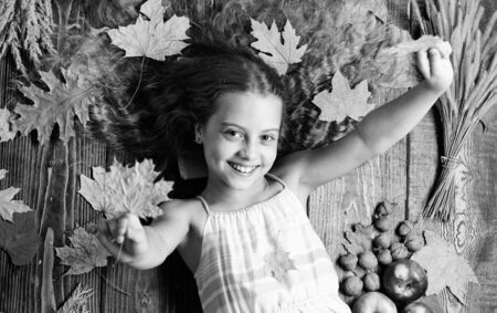 Autumn coziness is just around. Tips for turning fall into best season. Kid girl smiling face lay...