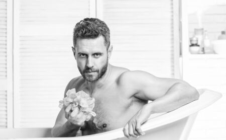 Bath have greater effect mood than physical exercise. Man bearded hipster use sponge cleaning skin....