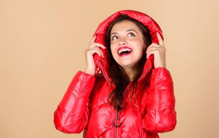 Red color. Finding right winter jacket is essential to enjoyable winter season. Snow or rain I am ready for both. Girl enjoy wearing bright jacket with hood. Warm coat. Comfortable down jacketの写真素材