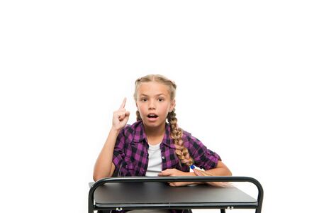 Homework idea. Little girl keeping finger raised isolated on white. Adorable small child reciting...