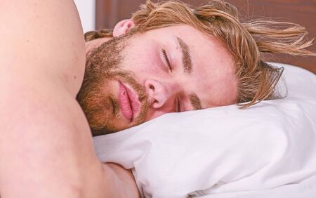 Get adequate and consistent amount of sleep every night. Expert tips on sleeping better. Bearded man...