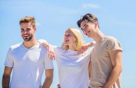 Sincere emotions. heaven concept. success heights. happy woman and two men. cheerful friends. friendship relations. family bonding and love. summer vacation. time to relax. group of people outdoorの写真素材