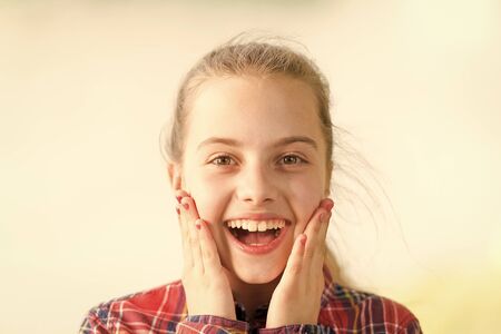 Wow shocking news. Kid long hair walking. Summer holidays. International childrens day. Surprising all the way. Surprise concept. Girl carefree child. Little child enjoy walk. Surprise suits herの写真素材