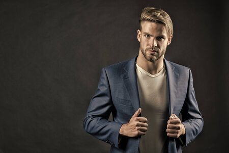 Young handsome man in blue suit