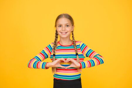 I love you with all my heart. Happy girl share love. Little child show hand heart gesture. Happy...