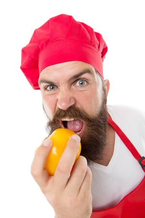 Healthy eating and enjoying food. Bearded hipster eat tomato isolated on white. Cook man with healthy vitamin vegetable. Leading healthy lifestyle. Food and dietの写真素材
