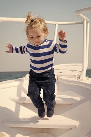 Memories made together last lifetime. Baby boy enjoy vacation sea cruise ship. Child sailor. Boy sailor travelling sea. Boy sailor striped shirt sea yacht travel around world. Little sea travellerの写真素材