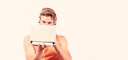 job inteview online. unshaven man listening music in headset. sexy muscular man listen sport music. man in earphones isolated on white. online job. copy spaceの写真素材