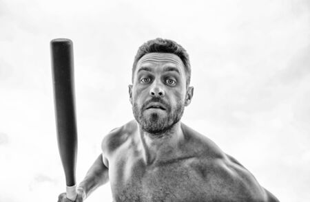 Bandit aggression anger. Muscular man fighting. Violence and attack. Street fight. Attack and defence. Get ready attack. Man with baseball bat. Hooligan hits bat. Victory requires payment in advanceの写真素材