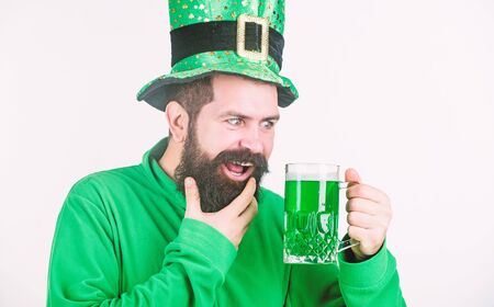 Irish tradition. Man brutal bearded hipster drink pint beer. Green beer mug. Drinking beer part of...