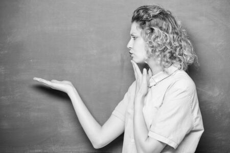 what is the answer. thoughtful student at blackboard. woman teacher at school lesson. knowledge day. empty blackboard information. back to school. woman likes studying. education. Students lifeの写真素材