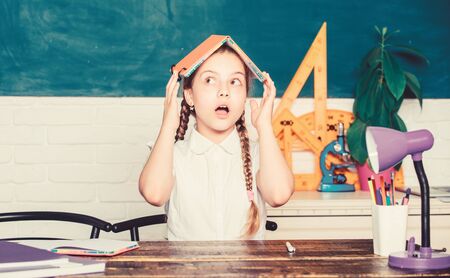 scared kid. digital age with modern technology. back to school. future success is studying. small girl study with in school. Formal informal and nonformal education. small child in classroomの写真素材