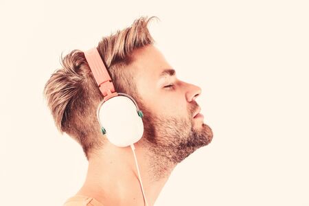 Man listening music headphones white background. Modern technology. Music taste concept. Enjoy perfect music sound headphones. Buy music gadget. Shop store musical accessory gadgets. Sale discountの写真素材