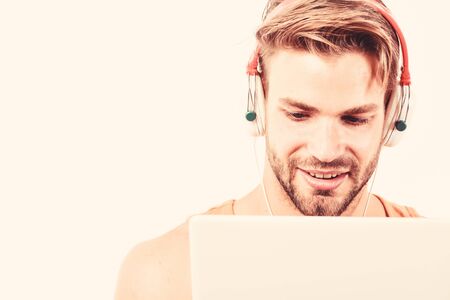vide3o conferencing. ebook and online education. music education. sexy muscular man listen ebook....