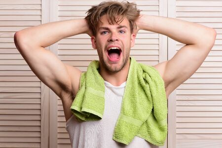 Athlete with strong muscles after morning shower. Morning exercises conceptの写真素材