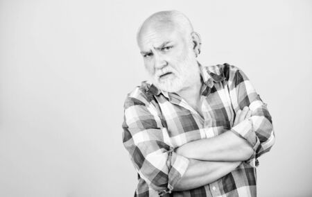 mature bearded man in checkered shirt. serious senior man with gray beard. grandfather on...