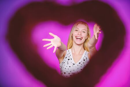 One and only. Valentines day party. happy woman on pink background. Love and romance. woman with decorative heart. Date. Romantic greeting. Valentines day salesの写真素材