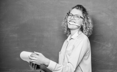 report project. back to school. girl teacher at school lesson. happy student in glasses at blackboard. teacher with document folder. new school year. Girl prepare for exams. Diary for girls conceptの写真素材