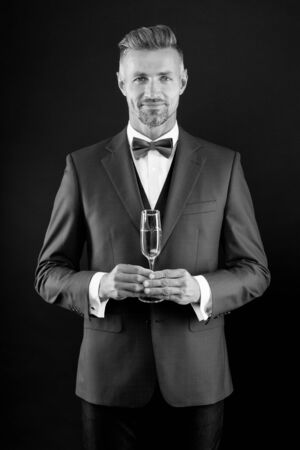 Sincere congratulations. Businessman drink sparkling wine. Celebrate success. Champagne toast. Champagne cheers. Man in suit corporate party. Boss director hold glass champagne. Business celebrationの写真素材
