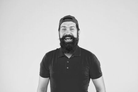 How can I help you. Supermarket staff wanted. Man bearded hipster with mustache wear uniform yellow...