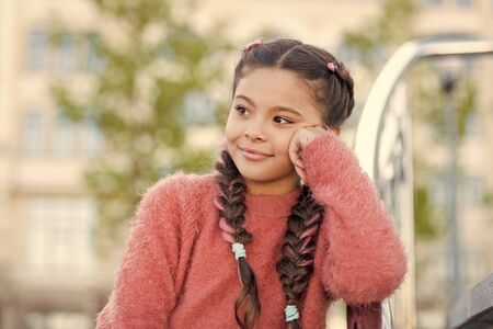 The beauty of being a girl. Beauty girl with long hair braids on summer day. Little child with cute...