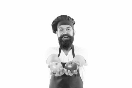 From food and nutrition expert. Bearded man cook hold organic tomatoes. Professional chef cook natural food. Vegetarian food. Cooking with natural foodの写真素材