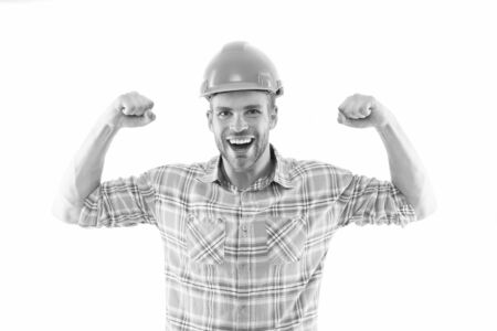 Successful engineer. Strong handsome builder. Man protective helmet and uniform white background....