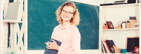 Teacher pretty woman enjoy educational process. onstantly learning new skills. Girl adorable teacher in classroom. Formal education. Teachers day. Teacher difficult but very rewarding professionの写真素材